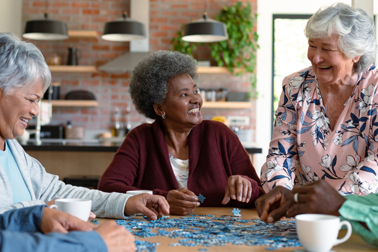 senior adults working on puzzle